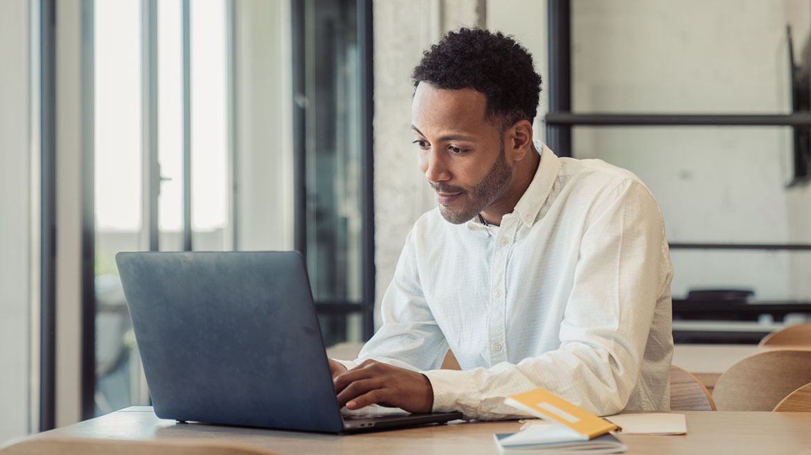young man using a laptop computer