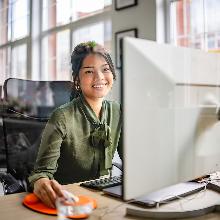 Woman at desk using a computer
