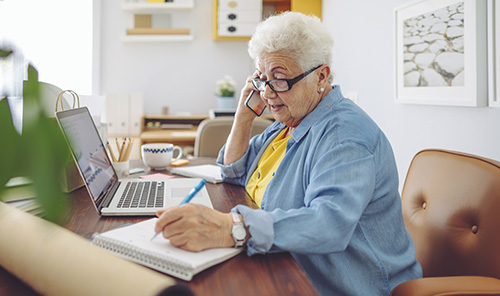 A person and a child looking at a computer